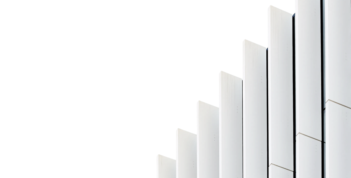 White architectural fins against a dark background